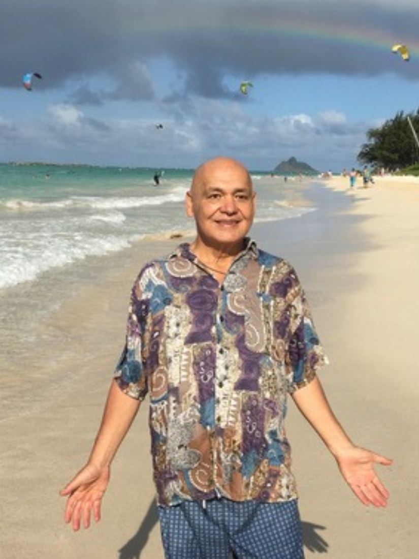 Thomas on the beach smiling 